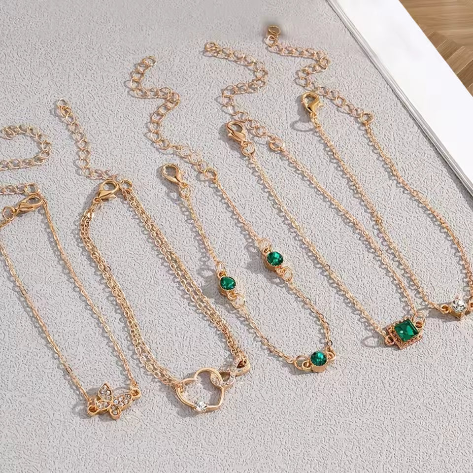 5-Piece Vintage Gold Bracelet Set: Infinity, Hearts, & Emerald Accents - Truly Yours